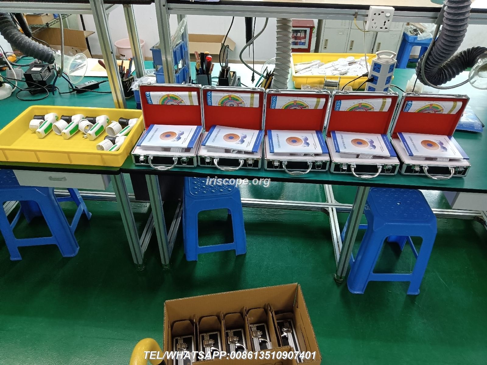 Modern manufacturing facility showing iridology equipment production line