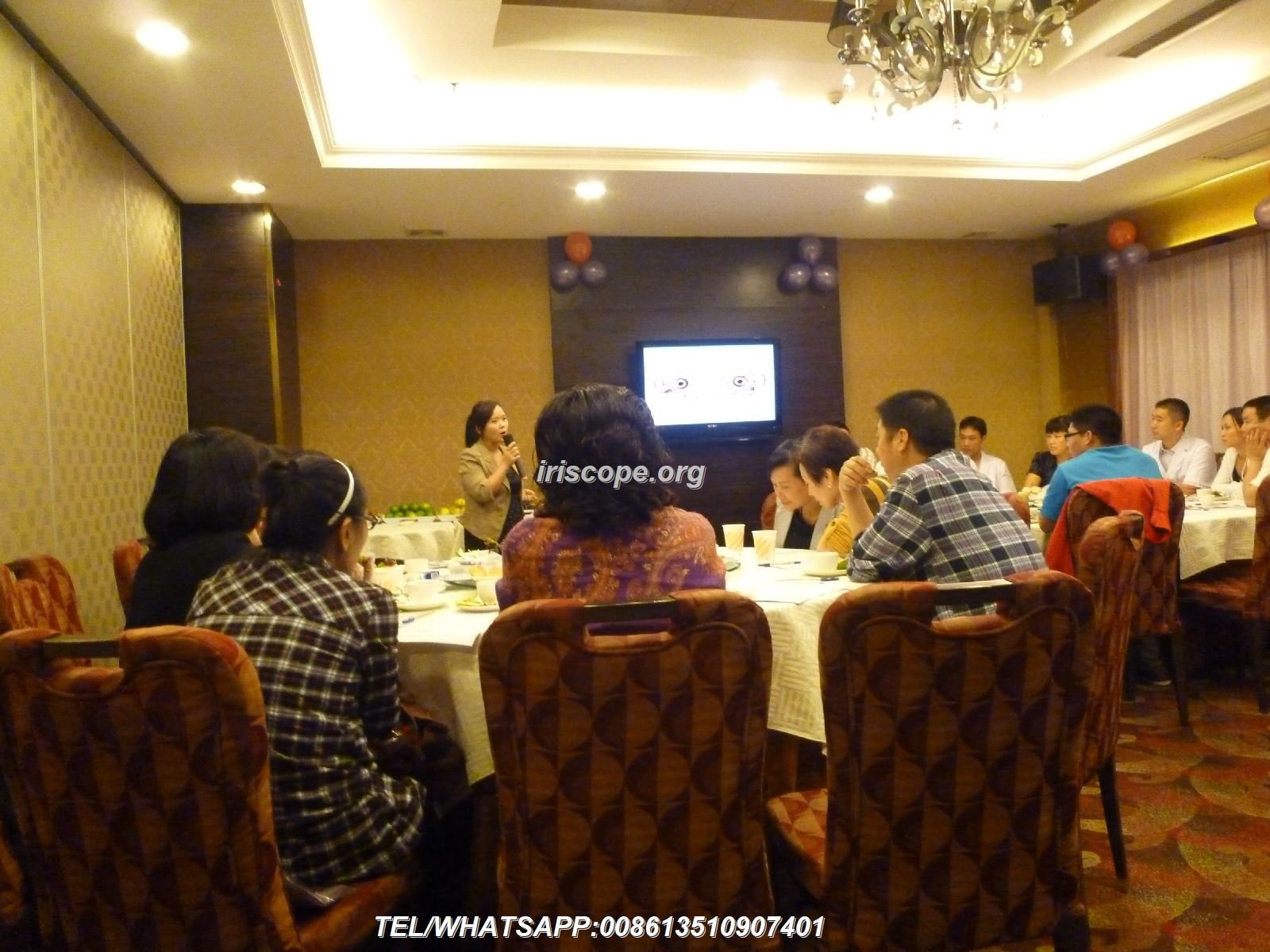 Professional iridology training classroom with iris camera equipment and students