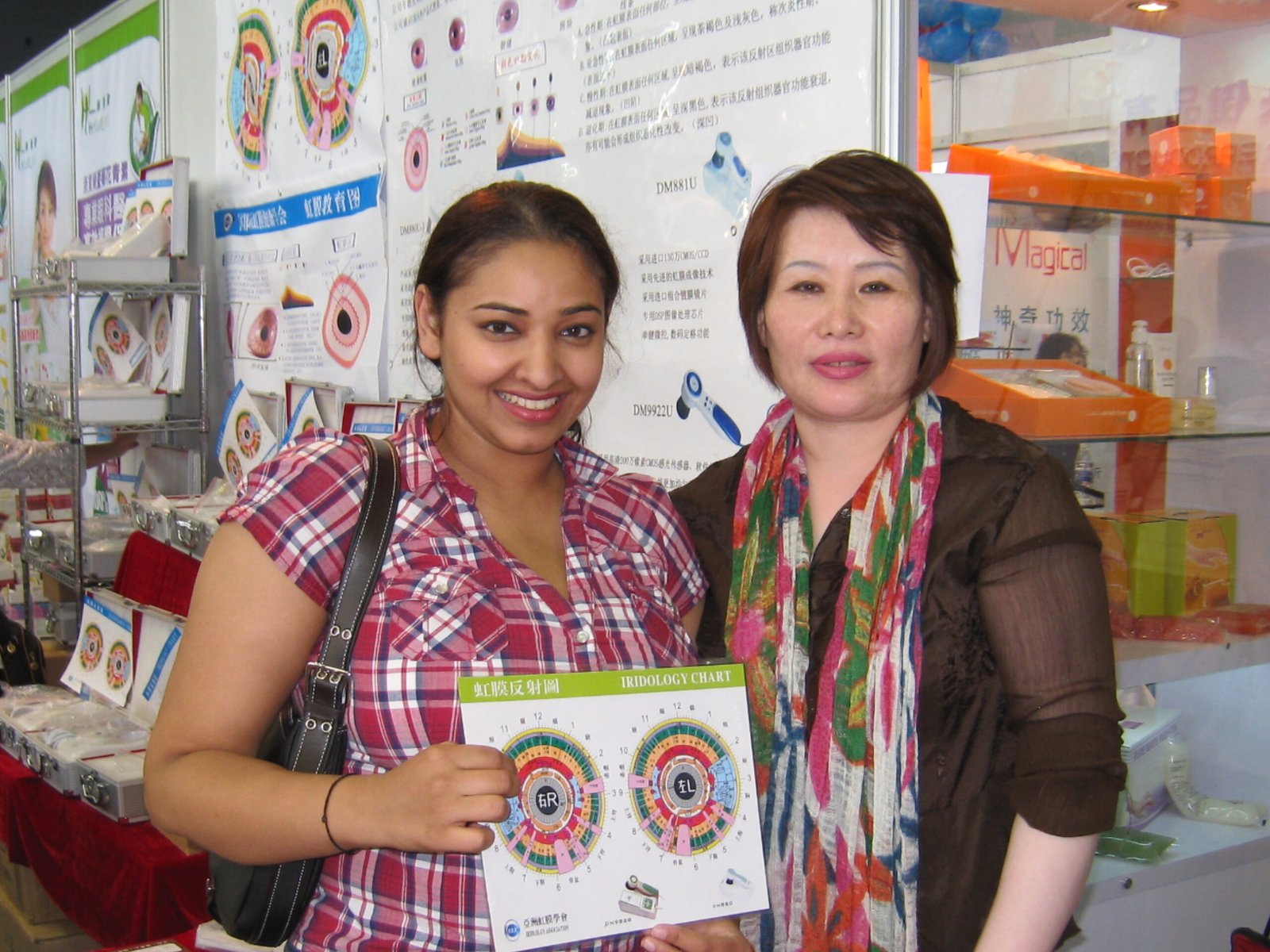 Wellness clinic consultation room with iridology charts displayed on walls