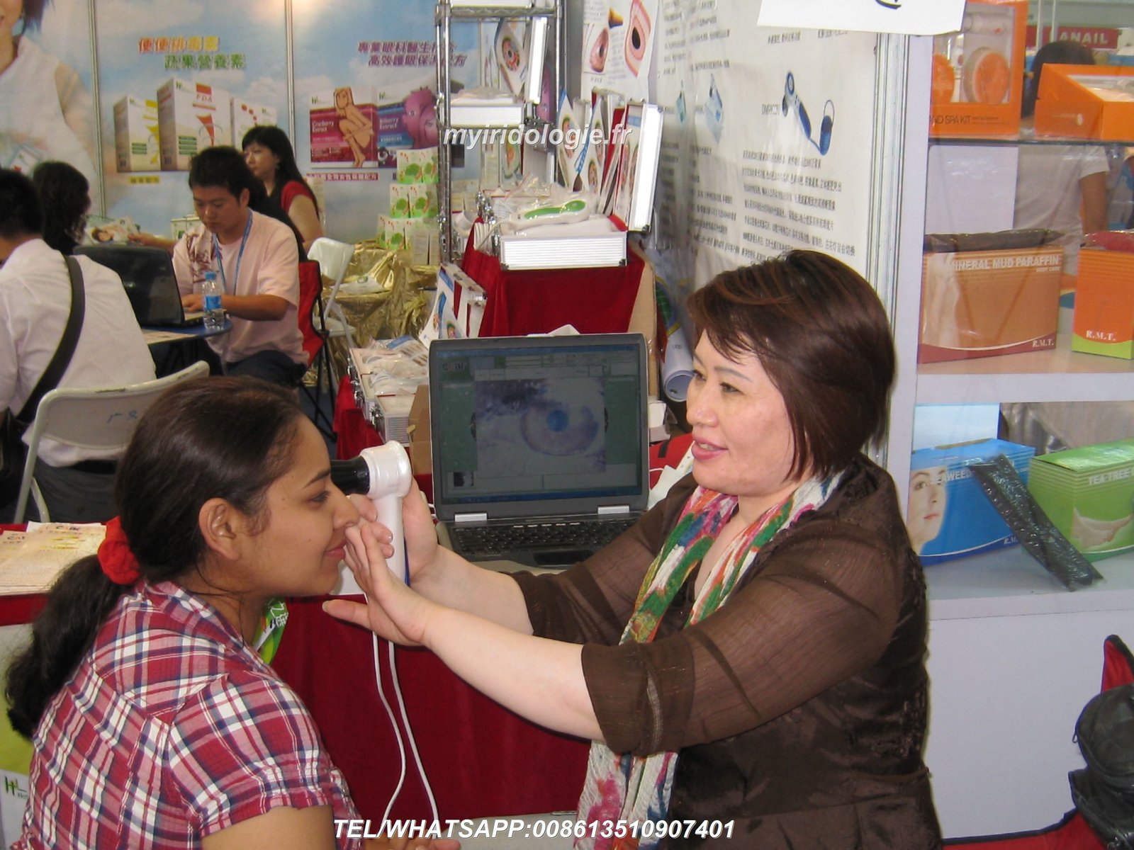 Practitioner demonstrating proper iris capture technique